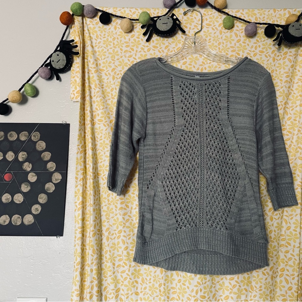 Absolutely brand. Small grey knitted acrylic sweater